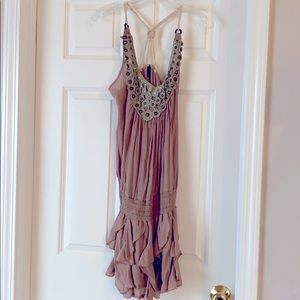 Ruffled tan dress with embellished neckline